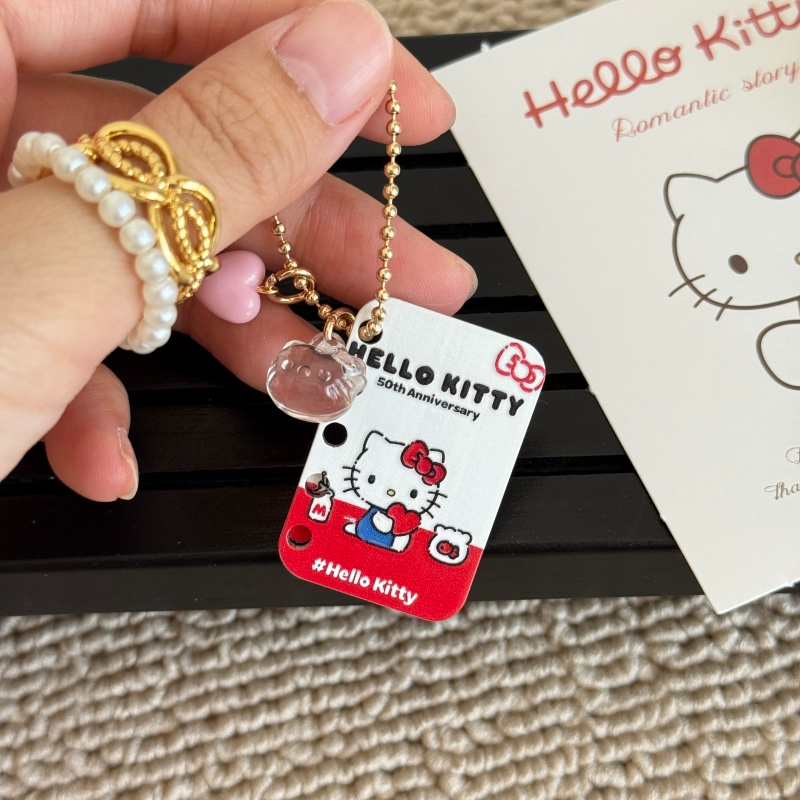 Adorno de Acrílico Hello Kitty Clásico | Con 5 Perforaciones para Llavero, Flip Book o Decoración